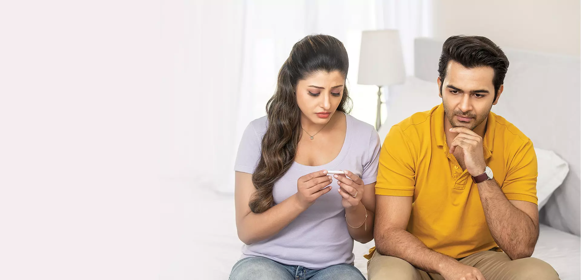 Infertile couple checking home pregnancy test